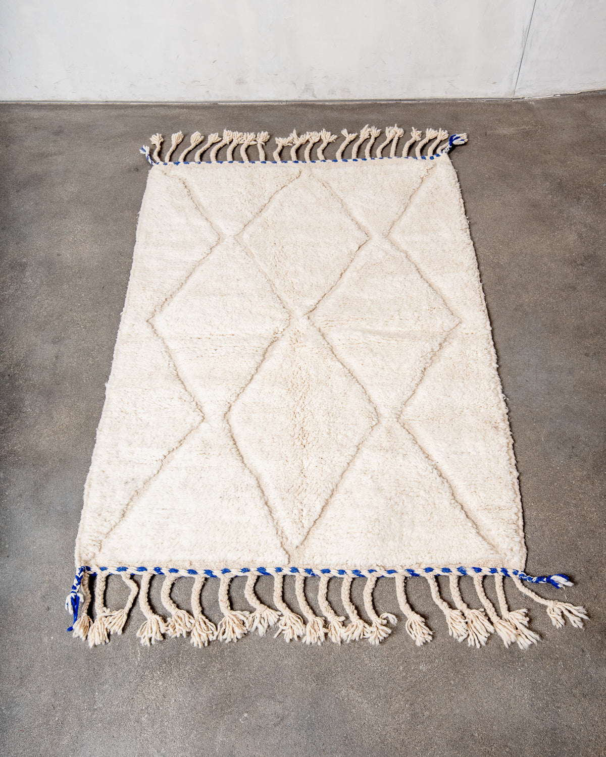 Modern, designer, handcrafted Berber rug from Morocco. Beniourain carpet with beautiful colours and patterns and fluffy wool texture.